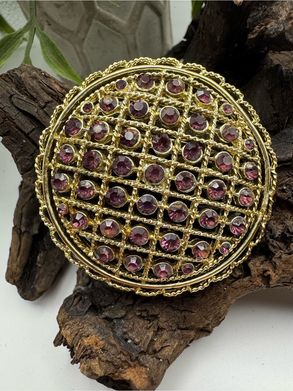 Vintage gold-tone domed basket weave brooch w/ sparkling purple rhinestones, EUC